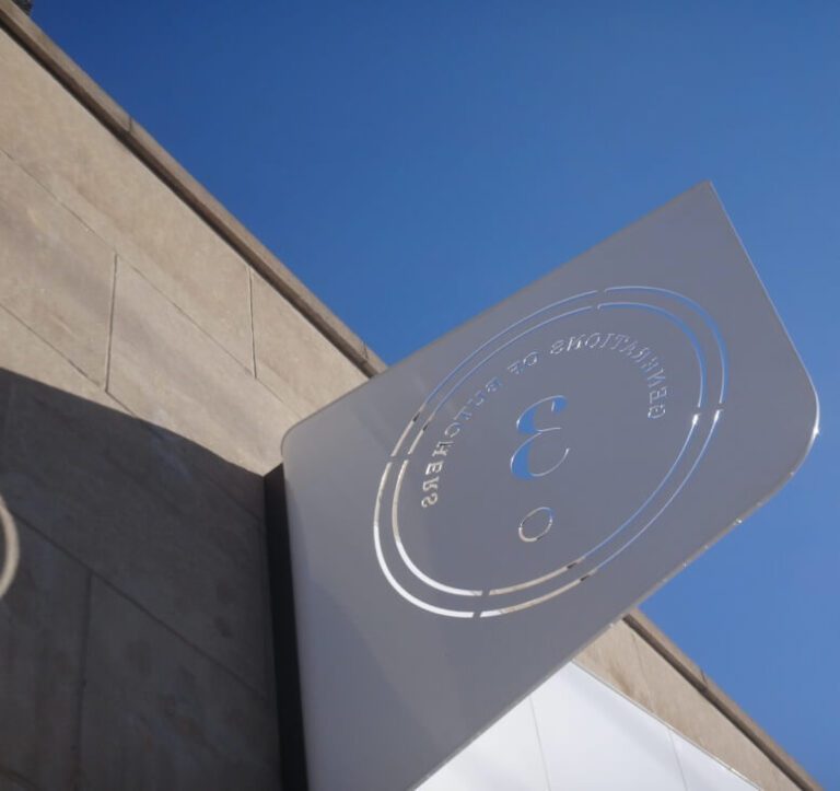 The laser cut storefront sign
